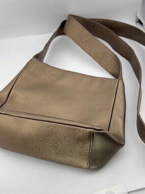 The SAK Antique Gold Metallic Leather Crossbody Zip close Small non-adjust strap